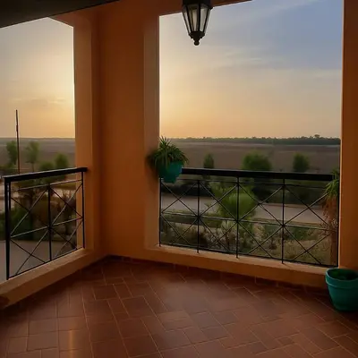 a room with a balcony with a view at Ricoflores PALM in O Ben Slimane