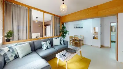 a living room with a couch and a table at My Cosy Place Rabat - Studio Agdal 50m Arribat Center in Rabat