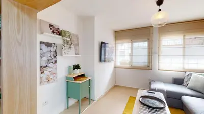 a living room with a couch and a table at My Cosy Place Rabat - Studio Agdal 50m Arribat Center in Rabat
