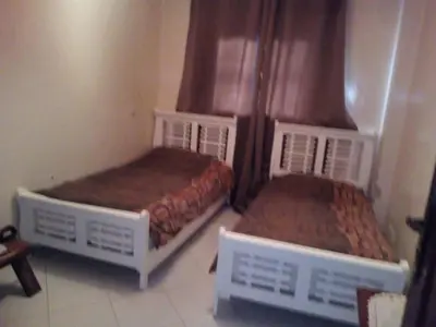 two beds in a small room at Bel appartement quartier Bourgogne in Casablanca