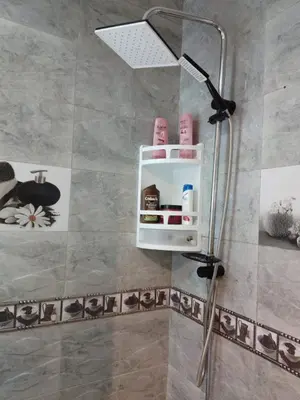a shower in a bathroom with a shower head at Bel appartement quartier Bourgogne in Casablanca