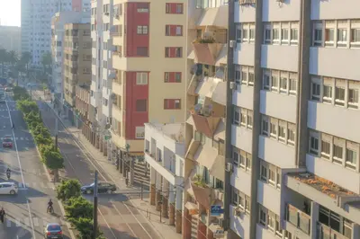 an image of a city street with tall buildings at Grand appartement lumineux avec balcon & parking idéal familles et pro in Casablanca