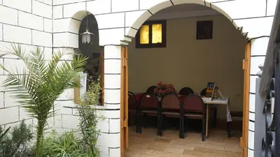 a dining room with a table and chairs at Auberges Des Jeunes Casablanca in Casablanca