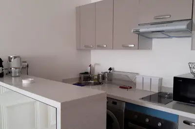 a kitchen with white cabinets and a white counter top at Chez Miguel Casablanca in Casablanca
