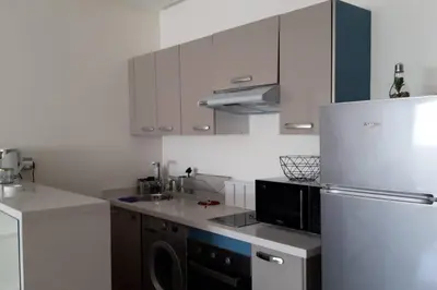 a kitchen with a white refrigerator and a dishwasher at Chez Miguel Casablanca in Casablanca