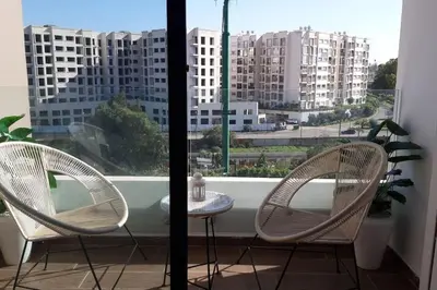 two chairs and a table in front of a window at Chez Miguel Casablanca in Casablanca