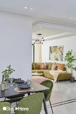 a living room with a couch and a table at Stayhere Rabat - Hay Riad - Sophisticated Residence in Rabat