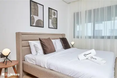 a bedroom with a bed with two pillows on it at Stayhere Rabat - Hay Riad - Sophisticated Residence in Rabat