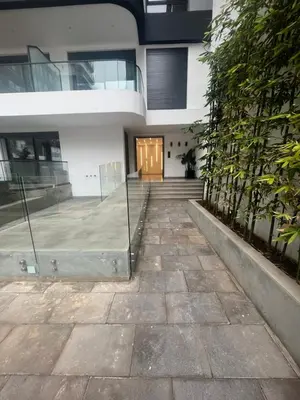 a building with a door and a walkway at Luxurious Appartement at Casa Finance City in Casablanca