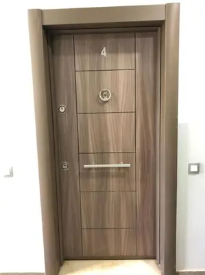 a wooden door with four drawers in a room at Charmant studio lumineux Casablanca in Bouskoura