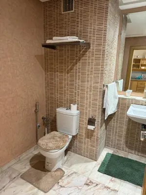 a bathroom with a toilet and a sink at Coup de cœur a 5mn de l aéroport in Nouaceur