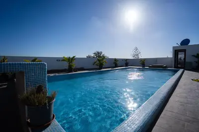 a swimming pool on the roof of a building at Paris-Oasis Casablanca in Casablanca