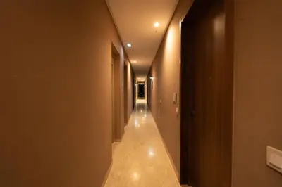 a hallway with a long corridor in a building at Paris-Oasis Casablanca in Casablanca