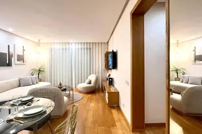 a living room with a couch and a table at The Panorama of Marina - AppartAli in Casablanca