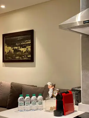 a table with bottles of water on top of a couch at Faubourgs Anfa Top Floor By AppartAli in Casablanca