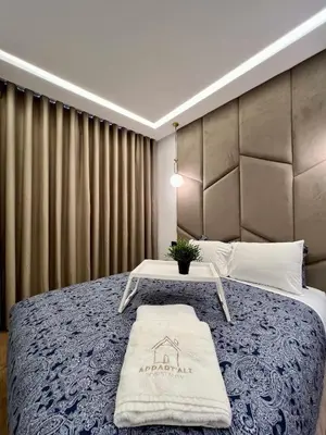 a bedroom with a large bed with a table on it at Anfa 212 Top Floor - 2 Bedrooms- By AppartAli in Casablanca