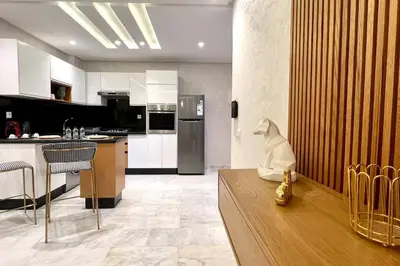 a kitchen with a statue of a dog sitting on a counter at The Suite of Artists - Central - By AppartAli in Casablanca