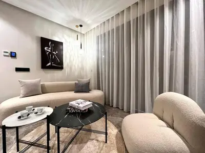 a living room with a couch and two chairs and a table at Presidential Suite City Center by AppartAli in Casablanca