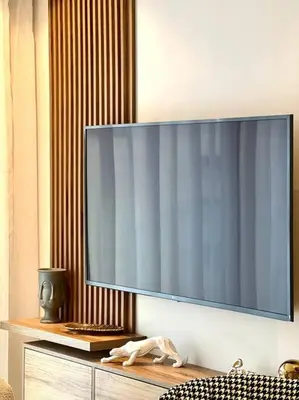a flat screen tv hanging on a wall at Presidential Suite City Center by AppartAli in Casablanca