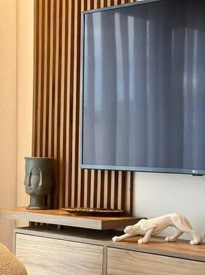 a flat screen tv on top of a wooden dresser at Presidential Suite City Center by AppartAli in Casablanca