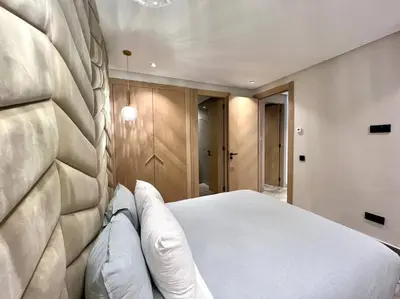 a bedroom with a large white bed with pillows at Centro 2 Bedrooms- By AppartAli in Casablanca