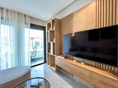 a living room with a large flat screen tv at Centro 2 Bedrooms- By AppartAli in Casablanca