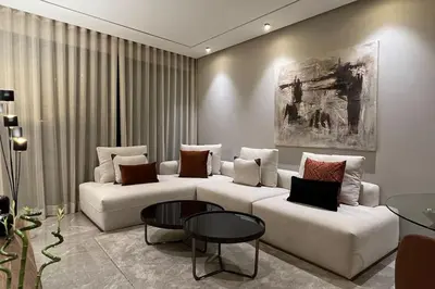 a living room with two white couches and a table at Royal Suite by the Ocean - By Appartali in Casablanca