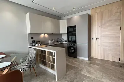 a kitchen with a counter and a dishwasher at Royal Suite by the Ocean - By Appartali in Casablanca