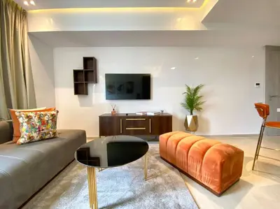 a living room with a couch and a table at La Corniche- Fab Design Ocean - By AppartAli in Casablanca