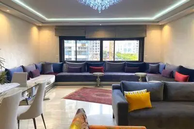 a living room with couches and a couch at Familial Boulevard D Anfa - By AppartAli in Casablanca