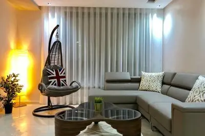 a living room with a couch and a table at Contemporary Top Floor Bourgogne - By AppartAli in Casablanca