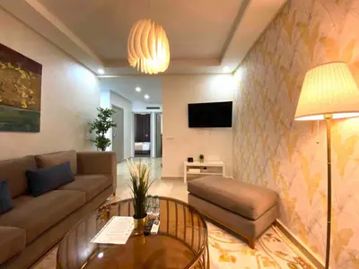 a living room with a couch and a table at Sunny OASIS 2 Bedrooms - By AppartAli in Casablanca