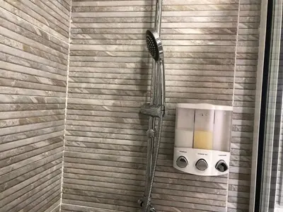 a shower in a bathroom with a hair dryer at Sunny OASIS 2 Bedrooms - By AppartAli in Casablanca