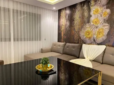 a living room with a couch and a table at Maarif City Sunrise- 3 Beds - By AppartAli in Casablanca