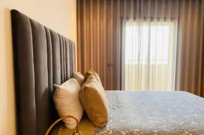 a bedroom with a bed with two pillows on it at Maarif Sunset View - 3 Bedrooms - By AppartAli in Casablanca