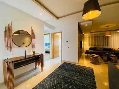a living room with a large mirror and a couch at Maarif Top Floor - 2 Bedrooms - By AppartAli in Casablanca