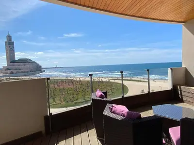 a balcony with a view of the beach and the ocean at The view - Marina 2 Beds - By AppartAli in Casablanca