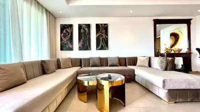 a living room with a couch and a table at The view - Marina 2 Beds - By AppartAli in Casablanca