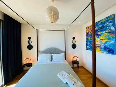 a bedroom with a large bed with a canopy at The view - Marina 2 Beds - By AppartAli in Casablanca