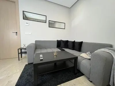 a living room with a couch and a coffee table at Modern Cosy Studio Anfa in Casablanca