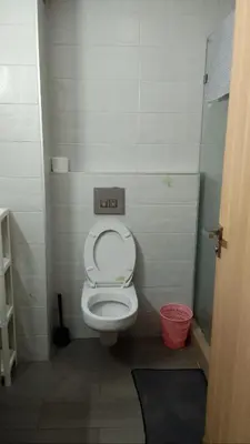 a small bathroom with a toilet in a stall at Apartment kamal park E21 in Mohammedia