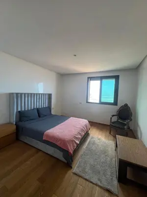 a bedroom with a bed and a window at Marina Casablanca Ocean view in Casablanca