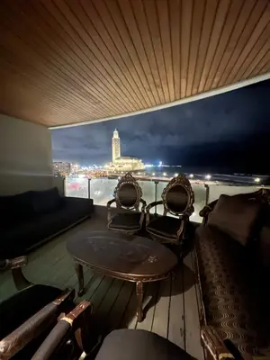 a table and chairs on a balcony with a view at Marina Casablanca Ocean view in Casablanca