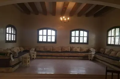 a large living room with couches and windows at Escape! Ultimate Getaway for Friends in Casablanca
