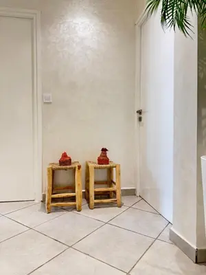 two tables with red baskets on them in a room at SUITOUISS - Océan 1 - Appartement centre ville au front de mer in Rabat