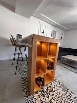 a living room with a desk and a table at Studio minimaliste marbella beach in Mansouria