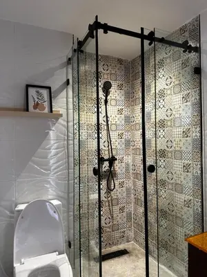 a bathroom with a shower with a toilet in it at Studio minimaliste marbella beach in Mansouria