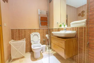 a bathroom with a toilet and a sink at AeroChic in Nouaceur