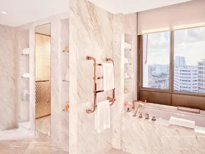 a bathroom with a shower and a sink at Royal Mansour Casablanca in Casablanca