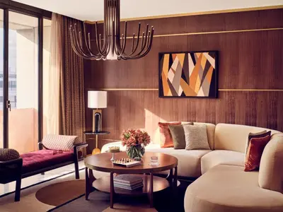a living room with a couch and a table at Royal Mansour Casablanca in Casablanca